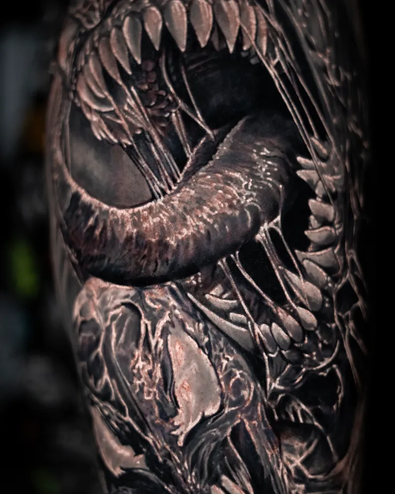 Close on a biomechanical jaw, its teeth and tongue filling the frame