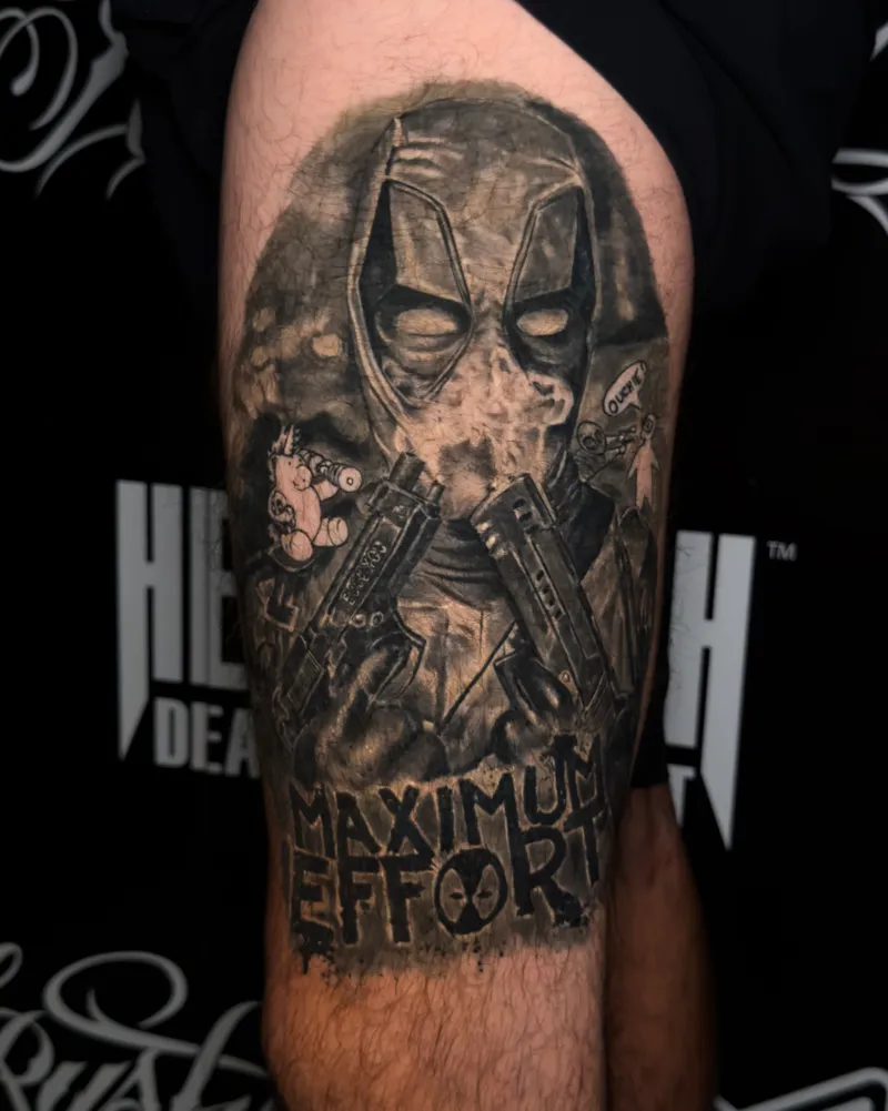 A healed thigh: a masked figure holding two pistols, with MAXIMUM EFFORT lettered underneath
